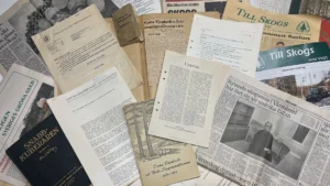 Historiska dokument och tidningsurklipp ur företagets arkiv